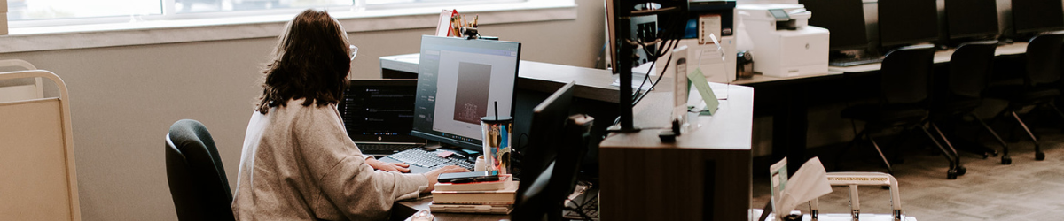 Individual in front of a desktop