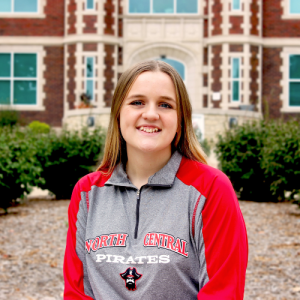 student in front of Geyer hall