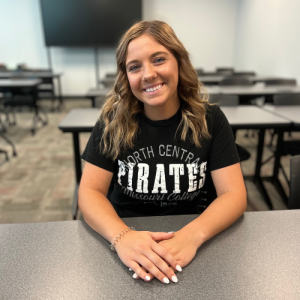 student wearing a black NCMC shirt