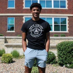 student wearing a black NCMC basketball shirt