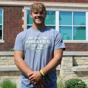 student wearing a gray NCMC shirt