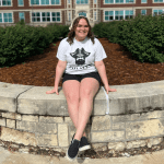 Student sitting in front of Geyer hall