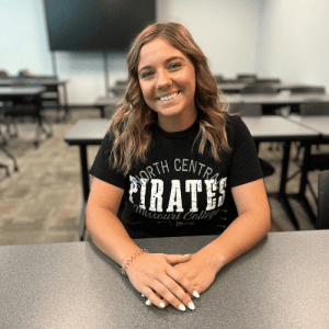 Student wearing black NCMC shirt