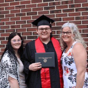 Graduate with two supporters