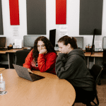 Two students studying at a table together