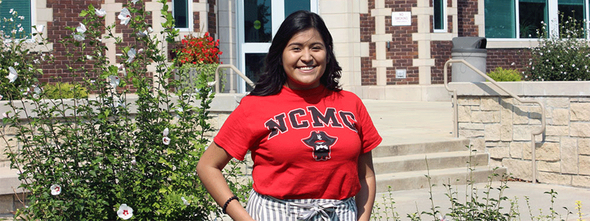 Student in front of Geyer Hall
