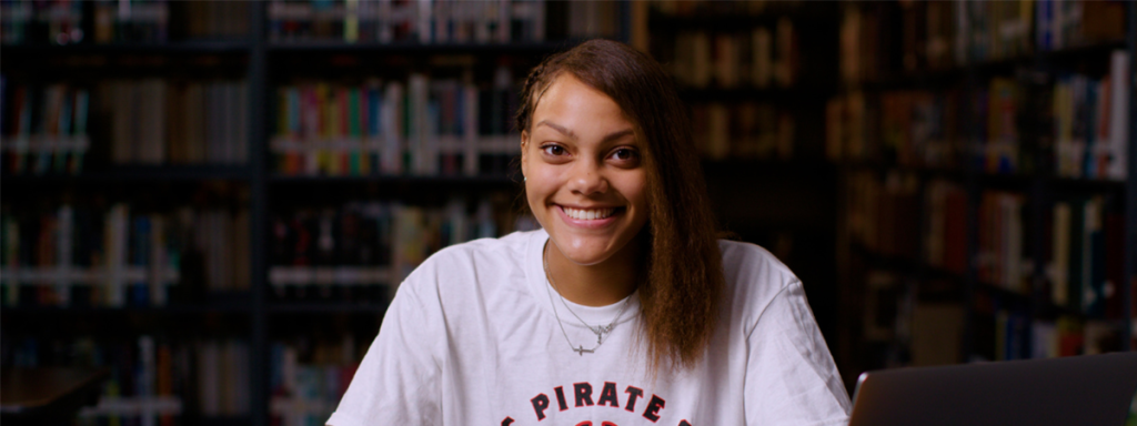 Student in Library Banner Image