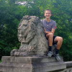 Student by a lion statue